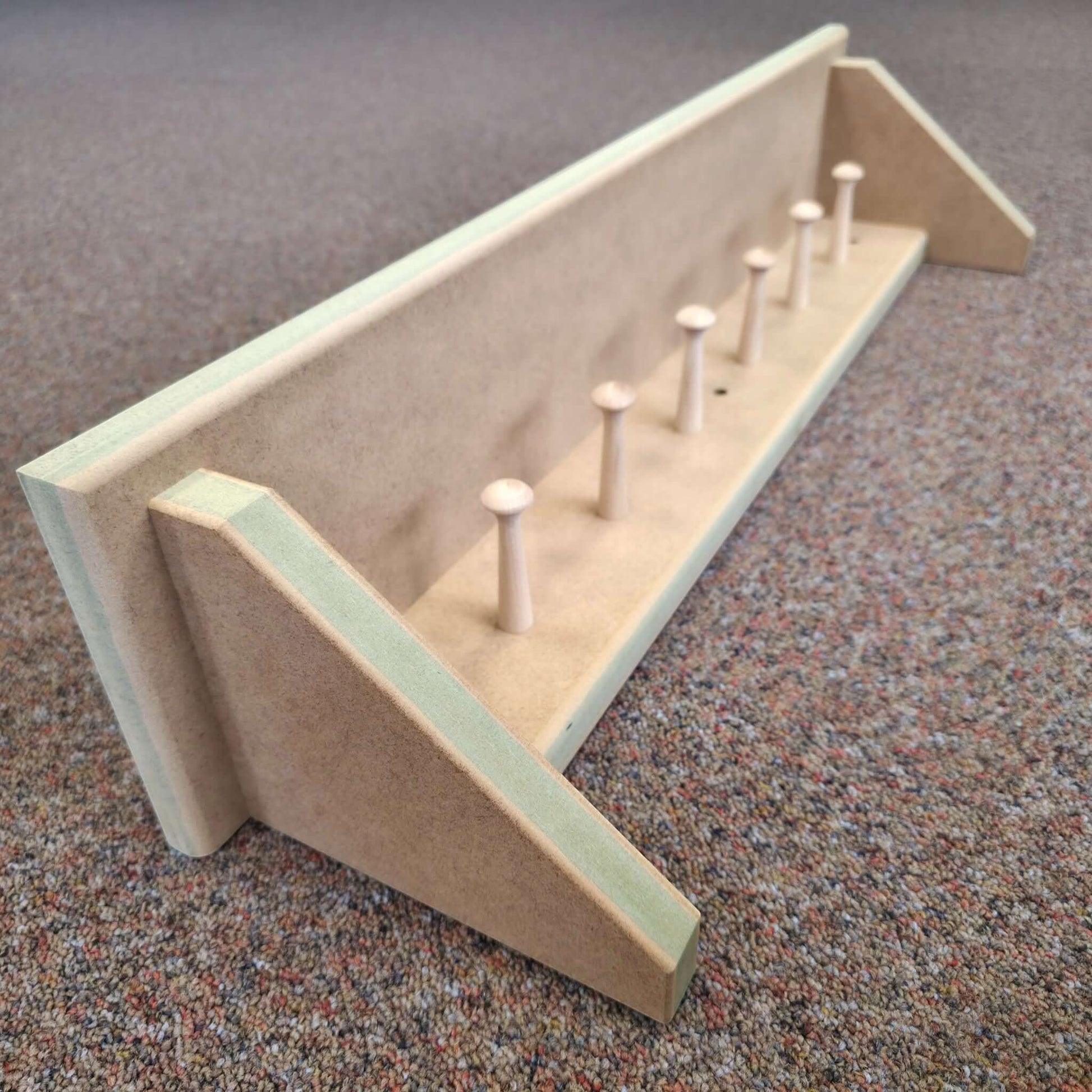 Modern Shaker Peg Shelf close-up showing handmade construction and pegs, perfect for hallway and nursery organization.