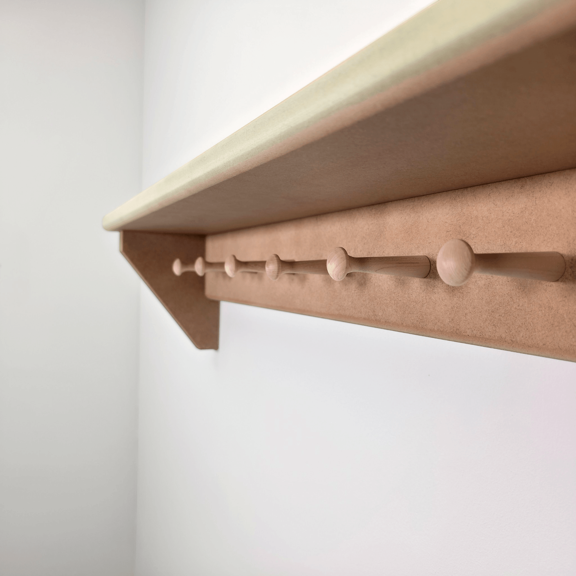 Modern Shaker Peg Shelf showcasing handmade design and peg details, perfect for hallway or nursery organization.