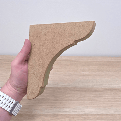 Traditional Shaker Shelf Bracket - Style 1 held in hand, showcasing clean profile and craftsmanship.