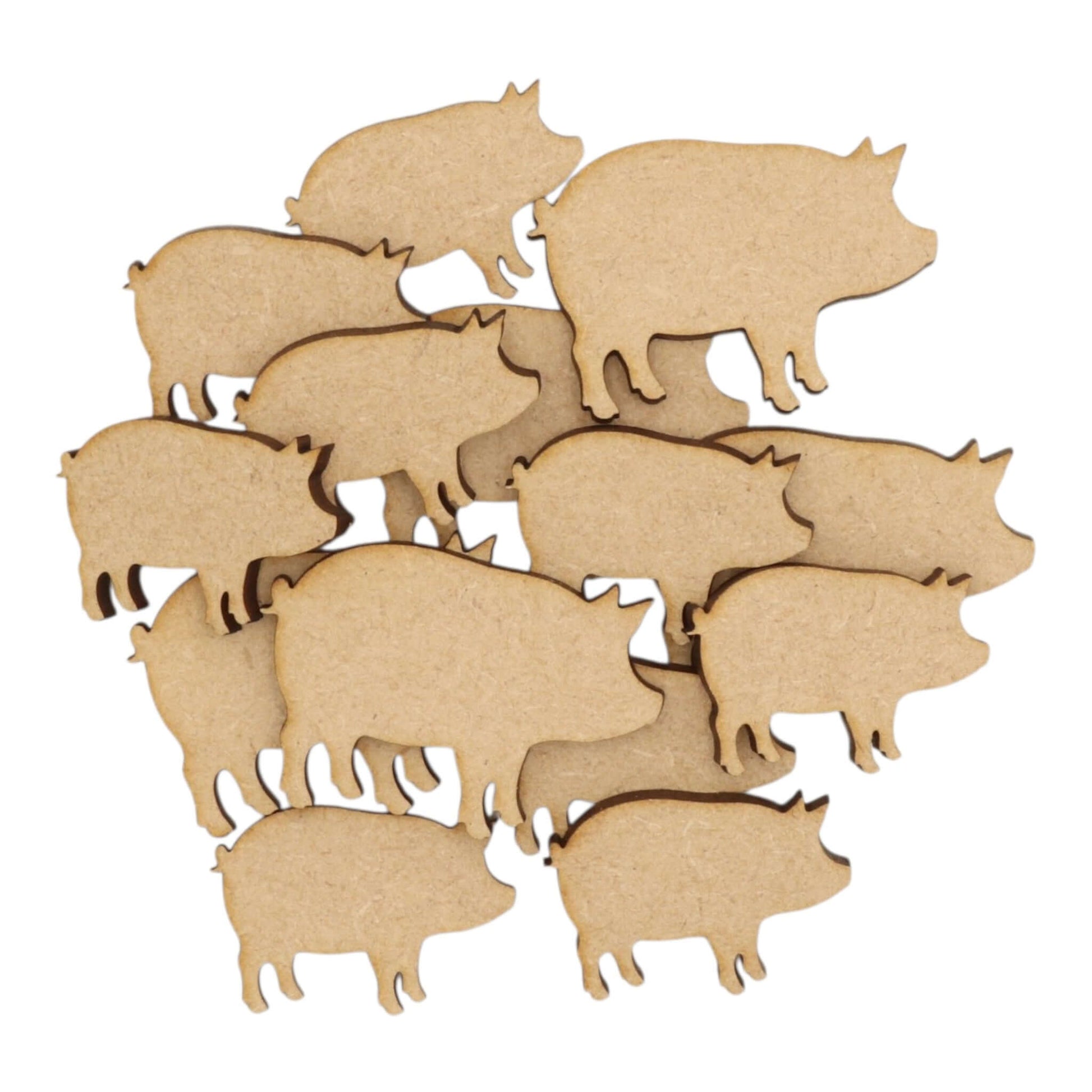 A collection of laser-cut Pig MDF Craft Shapes, perfect for farmhouse crafting and décor projects.