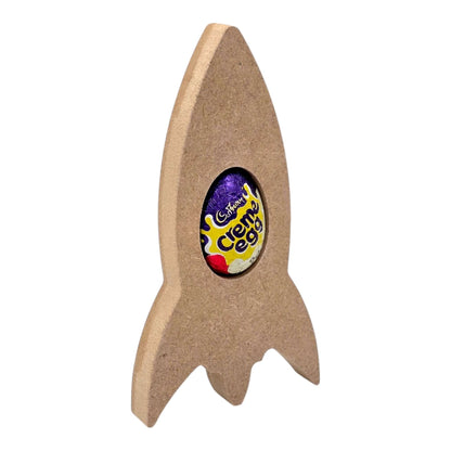 Rocket Ship Easter Egg Holder with a Cadbury Cream Egg nestled inside, perfect for Easter decorations.